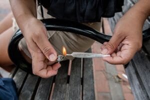lighting a marijuana joint