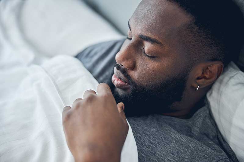 effects of cannbis indica - restful man in bed